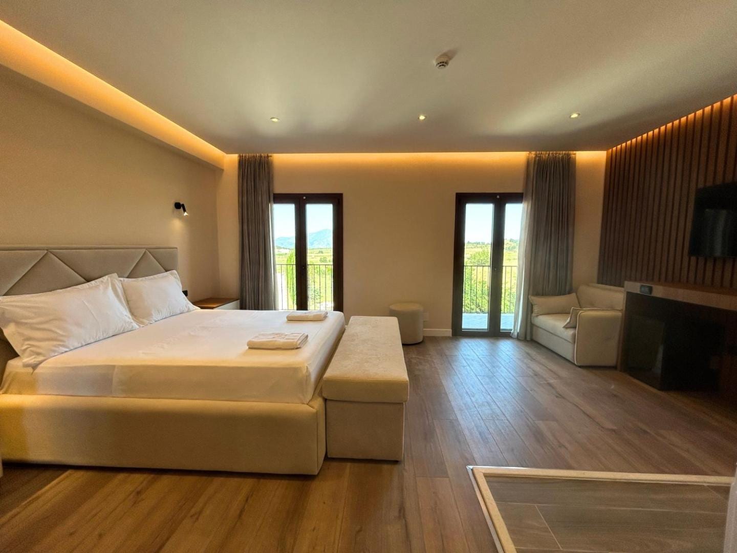Wood-slat feature wall behind the bed
